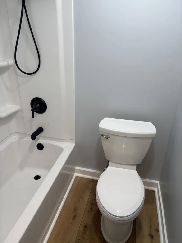 Modern Toilet with Black Metal Accents
