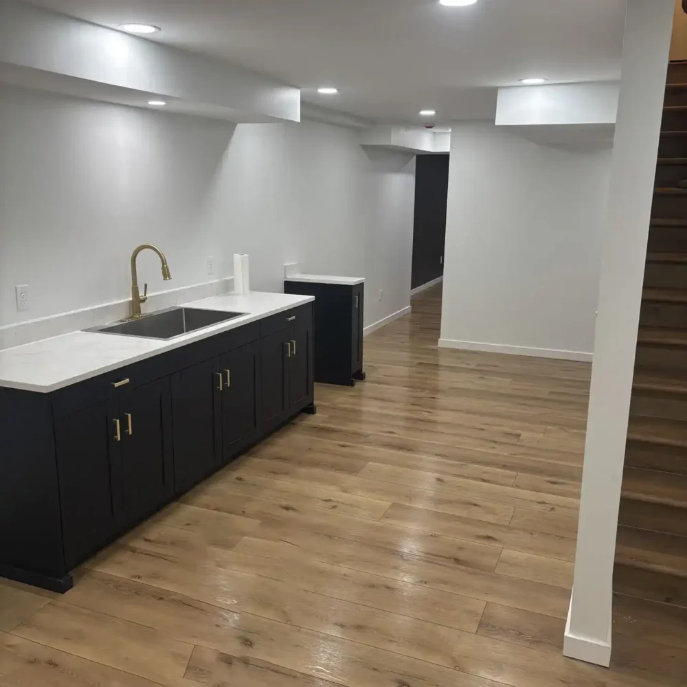 New Wooden Stairs and sink fixture in a Midwest Basement Remodel