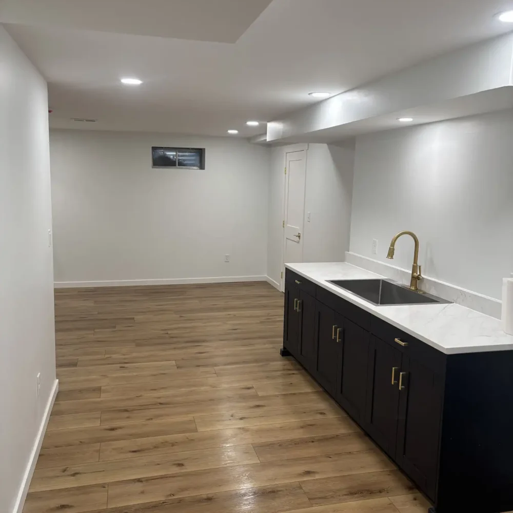 New Wooden Stairs and sink fixture in a Midwest Basement Remodel